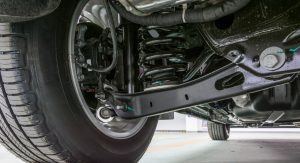 Technical photo. The structure of the modern car. Rear suspension. Shock absorber. Spring suspension.